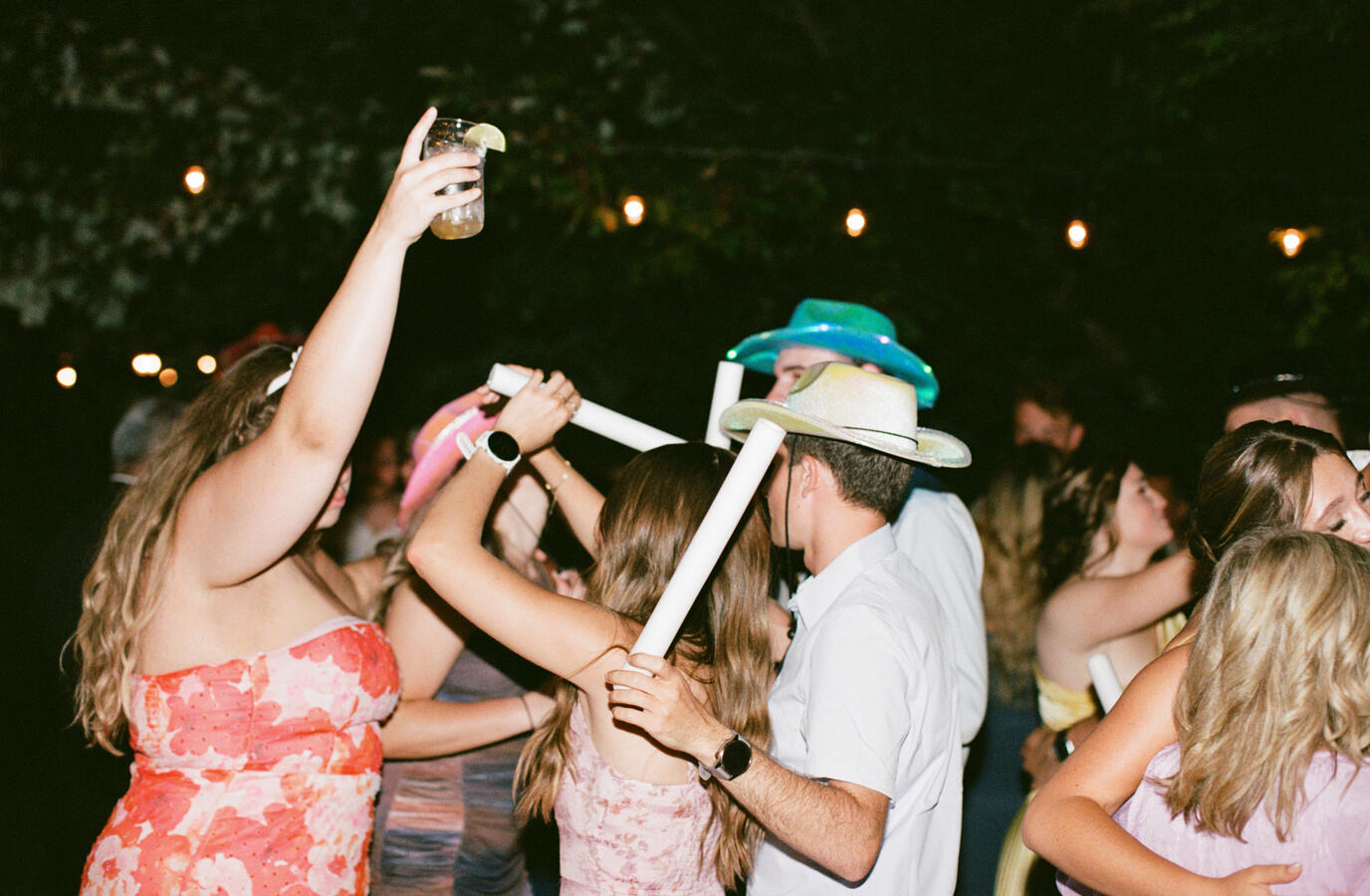 Guests enjoying cocktails prepared by Simple Bar at an outdoor celebration.