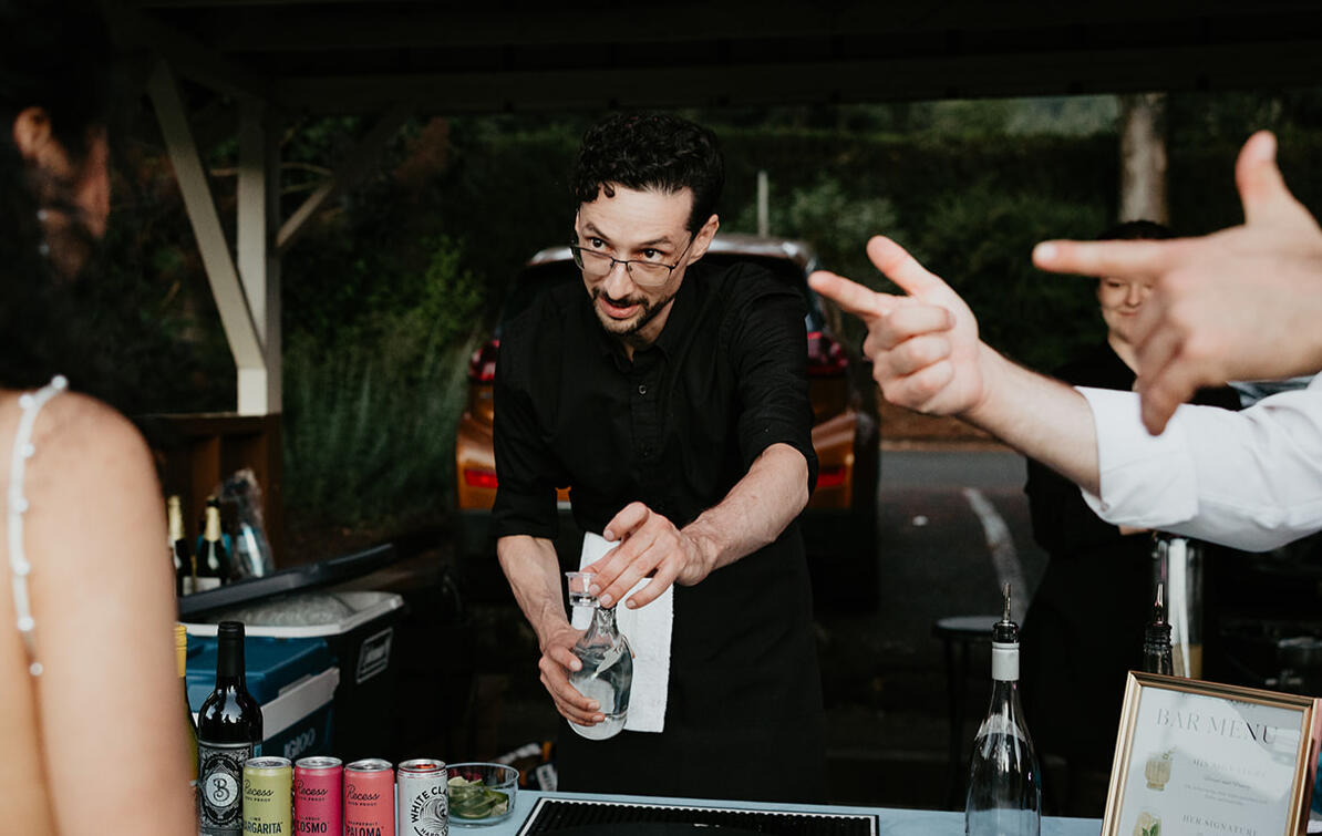 Simple Bar team providing professional bar service with a customized drink menu.