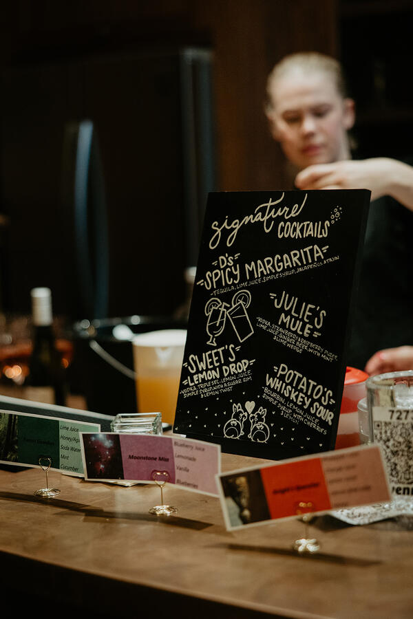 Simple Bar team providing professional bar service with a customized drink menu.