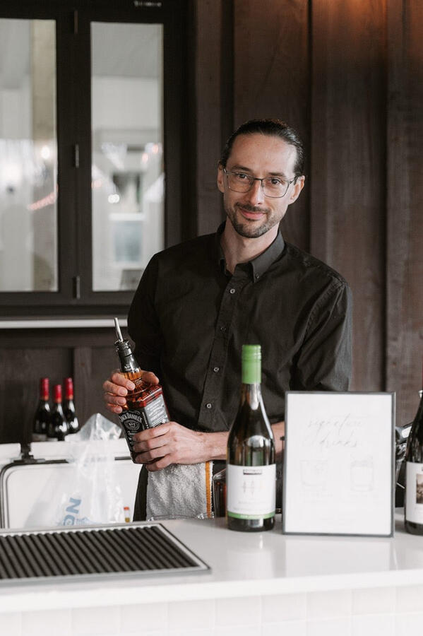 Simple Bar team providing professional bar service with a customized drink menu.
