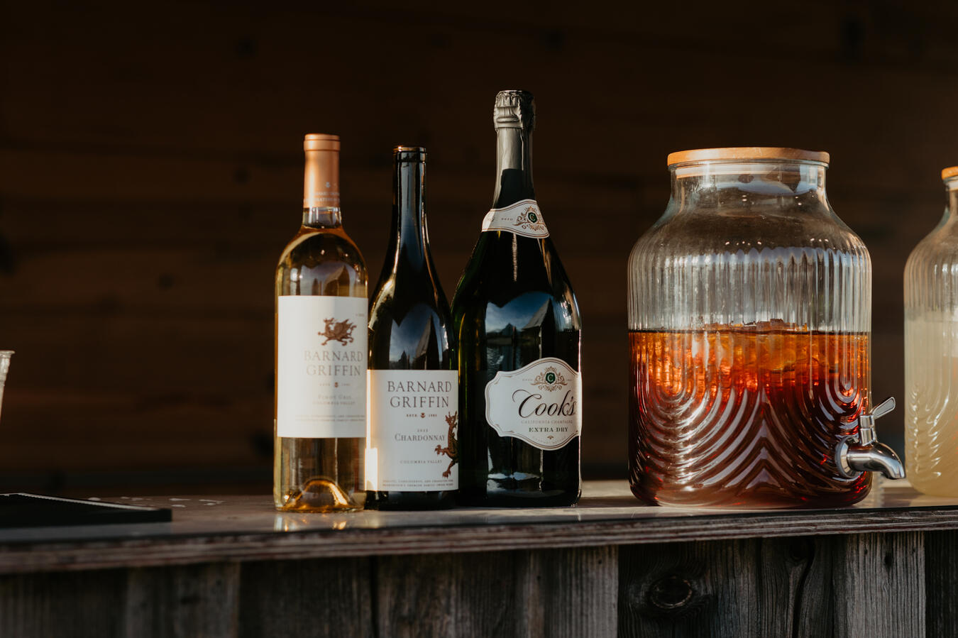 Professional bartender from Simple Bar mixing drinks behind a mobile bar setup.